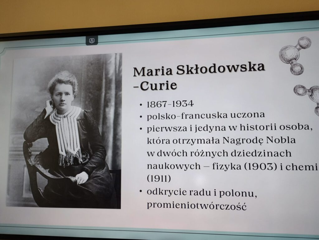 Slajd przedstawiający postać Marii Skłodowskiej - Curie - polskiej uczonej, laureatki Nagrody Nobla. .
